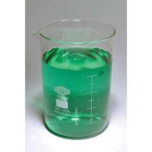 A beaker with green liquid and floating ice cubes.