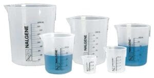 Various laboratory beakers with measurement markings, one containing blue liquid.