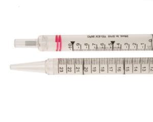 Two insulin syringes with measurement markings and red bands.